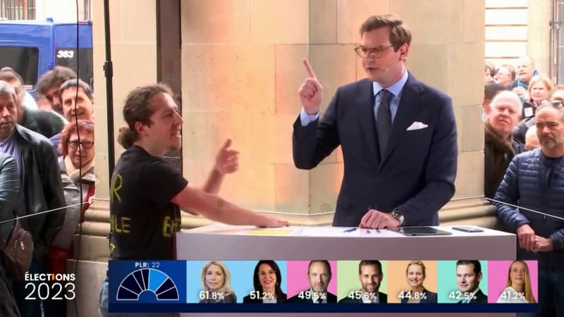Suisse: un militant écologiste se colle la main à un pupitre en plein débat télévisé